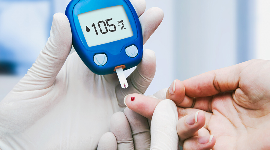 A person testing their blood sugar levels