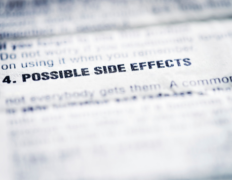 Close-up on the words 'Possible side effects' on an information sheet supplied with medicine.