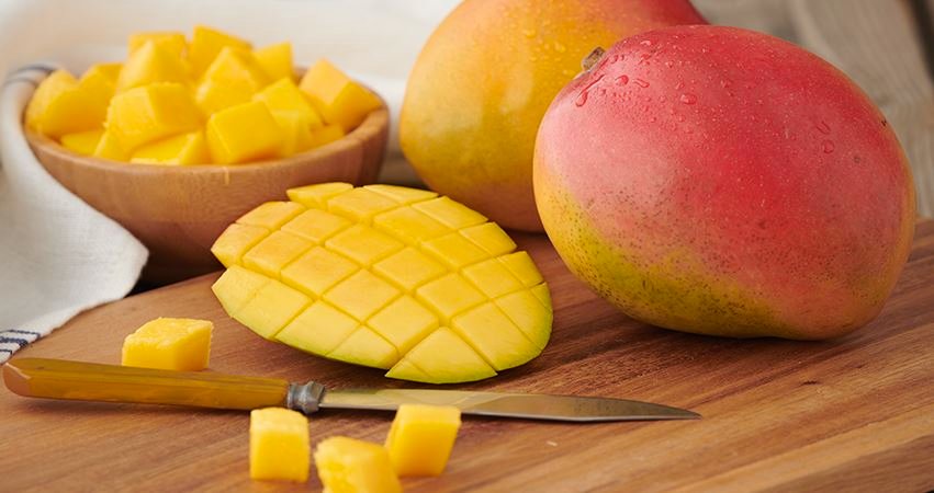 Mangoes: one diced, and two whole ones