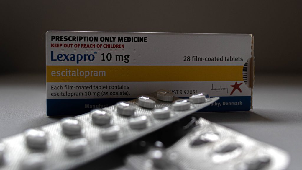 Lexapro tablets with its box in the background 