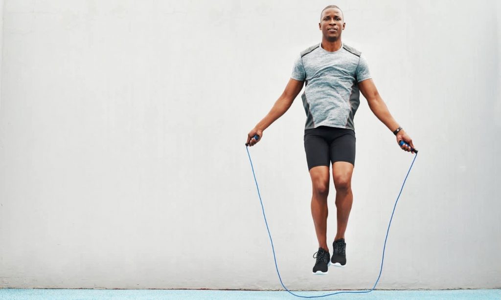 A man jumping with a skipping rope